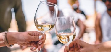 women holding wine glasses